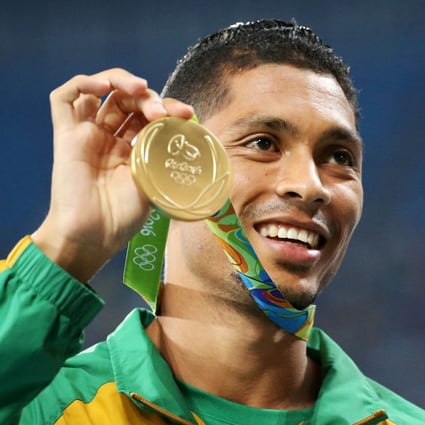 South Africa’s Wayde van Niekerk shows off his gold medal at the Rio Olympics. Photo: Reuters