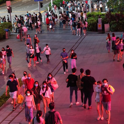 Pedestrians pass along Orchard Road in Singapore. Photo: Bloomberg