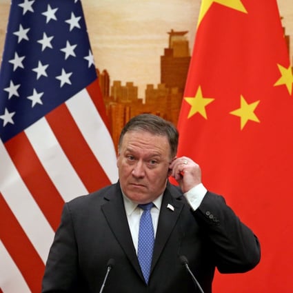 US Secretary of State Mike Pompeo adjusts his earpiece at a press conference in Beijing during a 2018 state visit. Photo: EPA-EFE