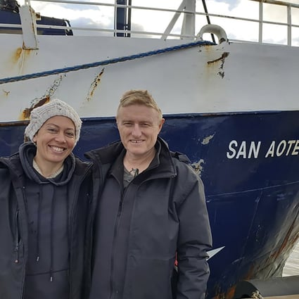 New Zealand couple Neville and Feeonaa Clifton pose next to the San Aotea II fishing boat in the Falkland Islands. Photo: Feeonaa/Neville Clifton via AP