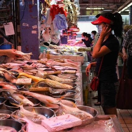 A shopper stops at a fish stall in Kowloon City Market on Wednesday. Photo: Nora Tam