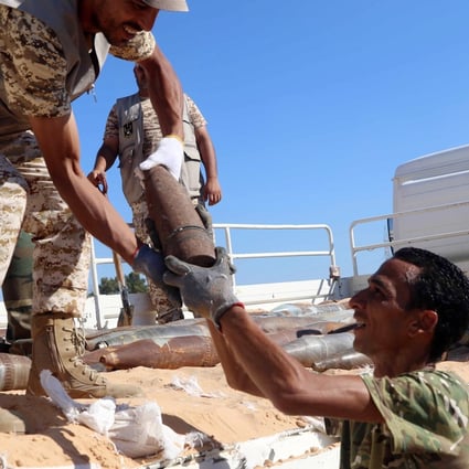 Military engineers of the UN-recognised Libyan Government of National Accord (GNA) collect mines and explosive devices uncovered from areas Al-Takbali camp. Photo: EPA-EFE