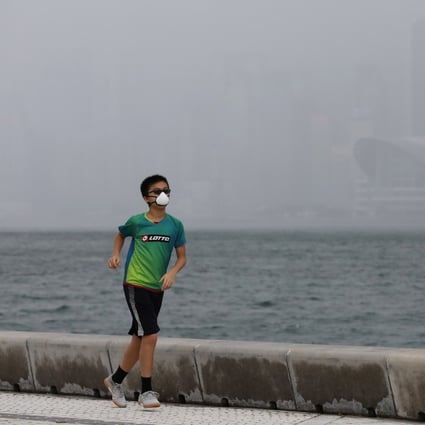 Hongkongers have to wear masks at all times, even when exercising, making for a very uncomfortable experience in the heat and humidity. Photo: May Tse