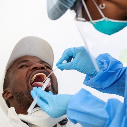 A medical worker takes a swab sample as part of a Covid-19 test in South Africa, which has been hard hit by the coronavirus. Photo: Reuters
