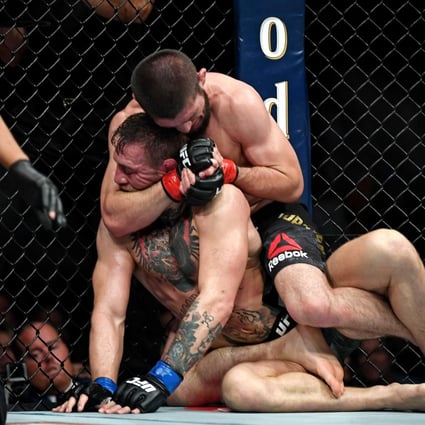 Khabib Nurmagomedov choks Conor McGregor during UFC 229. Photo: Stephen R. Sylvanie-USA TODAY Sports