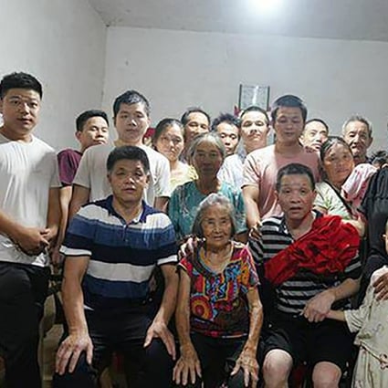 Zhang Yuhuan (front, second from right), gathers with his family after spending almost 27 years in prison before having his conviction overturned on August 4. After multiple appeals, the Supreme People’s Court in Jiangxi province threw out Zhang’s conviction over lack of evidence. Photo: Weibo