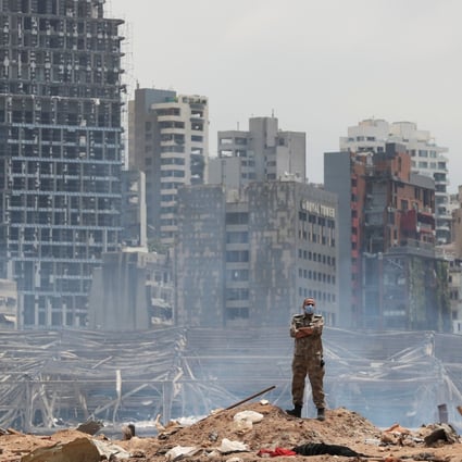 A soldier stands at the devastated site of the explosion at the port of Beirut. Photo: Reuters