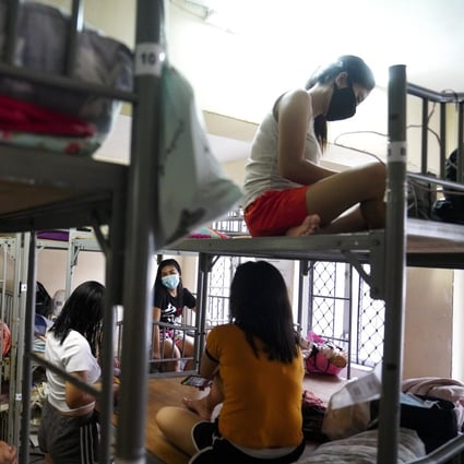 Domestic helpers who are between jobs gather at the boarding house run by Technic Employment Service Centre in Causeway Bay. Photo: Sam Tsang