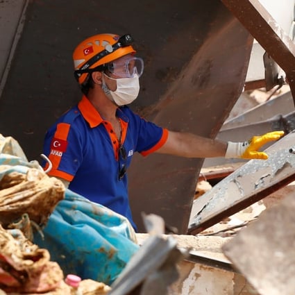 A member of Turkish rescue team works at the site of Tuesday's blast at Beirut's port area on Friday. Photo: Reuters