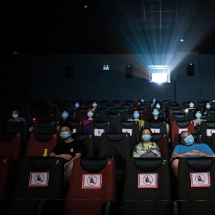 People watch a movie with masks on in a cinema in Wuhan, in China’s central Hubei Province, on July 20. Photo: Xinhua