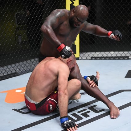 Derrick Lewis punches Aleksei Oleinik in their heavyweight fight during the UFC Fight Night event at UFC APEX in Las Vegas, Nevada. Photos: Chris Unger/Zuffa LLC