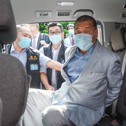Hong Kong media mogul Jimmy Lai Chee-ying was arrested and brought out by police from his flat early on Monday on suspicion of breaching national security law. Photo: SCMP / Felix Wong