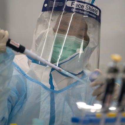 A lab technician processing Covid-19 tests at a laboratory in Hong Kong. Photo: Bloomberg