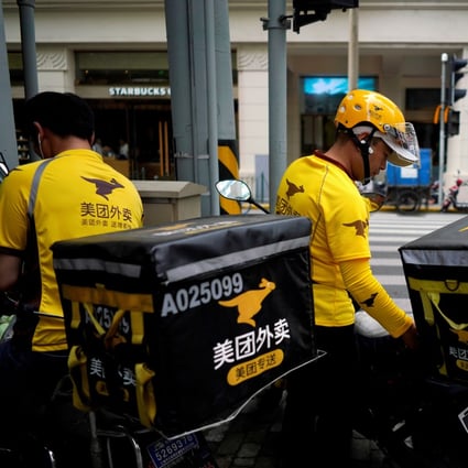 Drivers of food delivery service Meituan are seen in Shanghai, China. Photo: Reuters