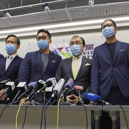 Civic Party members Dennis Kwok (right), Alvin Yeung, (third right), and Kwok Ka-ki (fourth right) attend a news conference after being disqualified from the Legislative Council elections. Photo: AP