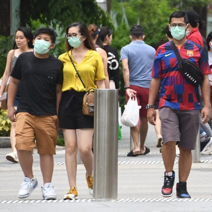 People seen in face masks at Orchard Road in Singapore. File photo: AFP