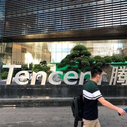 People walk past a Tencent Holdings sign at the company’s headquarters in Shenzhen, in southern Guangdong province, on August 7. Photo: Reuters