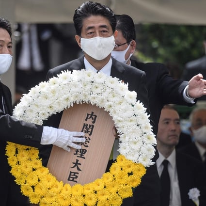 Japanese Prime Minister Shinzo Abe lays a wreath during a ceremony marking the 75th anniversary of the atomic bombing of Nagasaki. Photo: AFP