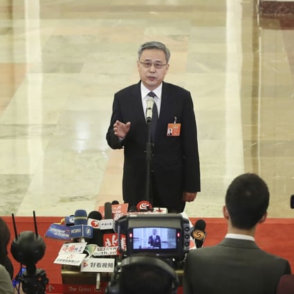 Guo Shuqing, chairman of the China Banking and Insurance Regulatory Commission, said that an increase in bad loans puts huge pressure on the nation’s lenders, especially small and regional ones. Photo: Xinhua