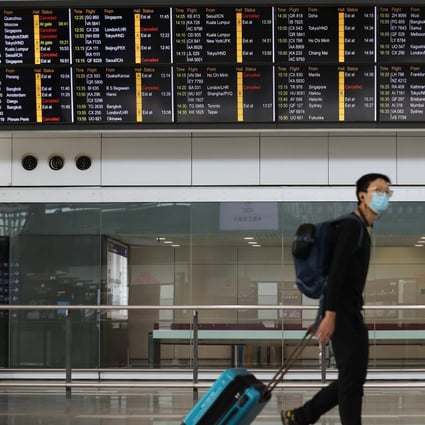 A lone passenger walks through Hong Kong International Airport in February, before the full impact of Covid-19 was felt in the aviation industry. Photo: Winson Wong