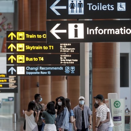 A group of travellers pictured in the departure hall of Changi Airport in Singapore on July 30. Photo: EPA