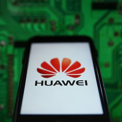 The Huawei logo is displayed on an iPhone. Huawei is just one Chinese firm caught in the crossfire of escalating US-China confrontations. Photo: Bloomberg