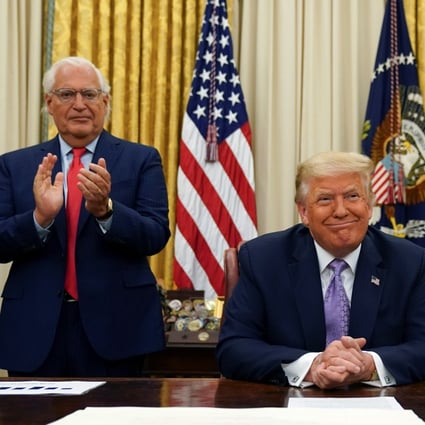 U.S. Ambassador to Israel David Melech Friedman (left) and White House senior adviser Jared Kushner applaud after US President Donald Trump announced a peace deal between Israel and the United Arab Emirates on Thursday. Photo: Reuters