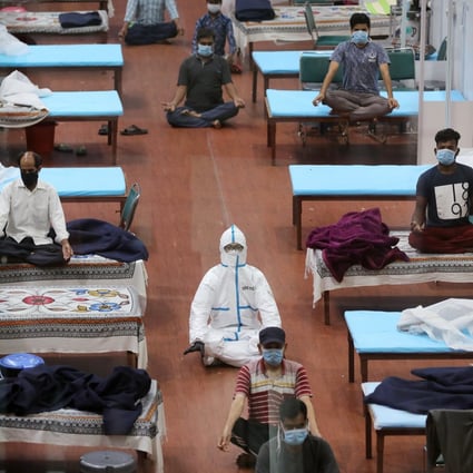 A yoga session at the men’s ward in the Covid-19 Care Centre set up at the Commonwealth Games Village Sports Complex in New Delhi, India, on July 30. India’s needs major reforms, and quickly, for its health care system to cope with Covid-19. Photo: Bloomberg