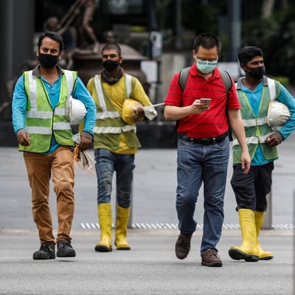 Construction workers on Orchard Road, Singapore. Photo: Reuters