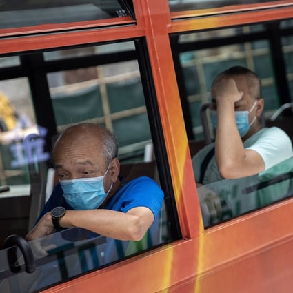 Tram passengers in protective face masks. Hong Kong is battling a third wave of Covid-19 infections. Photo: EPA-EFE