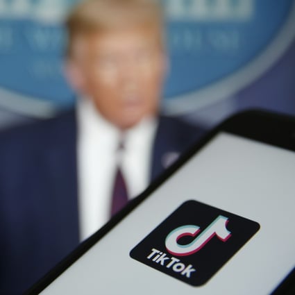 The TikTok logo is displayed in the app store in this arranged photograph in view of a video feed of US President Donald Trump in London, UK, on Aug. 3, 2020. Photo: Bloomberg