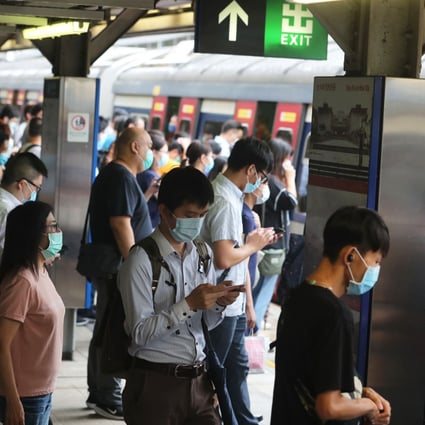 Commuters at Hong Kong’s Tai Tai Station prepare to board a train after resumption of services after the Observatory lowered the typhoon signal to No 3. Photo: Sam Tsang