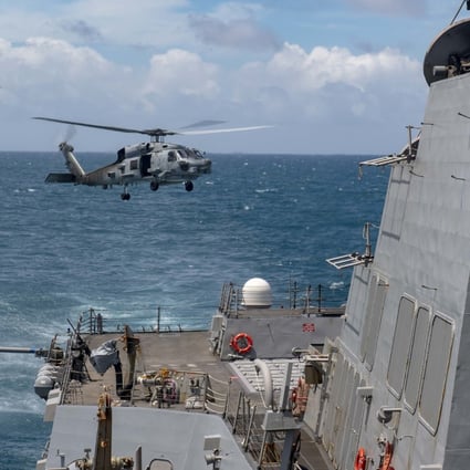 An MH-60R helicopter takes off from the flight deck of the USS Mustin during routine operations. Photo: US Navy