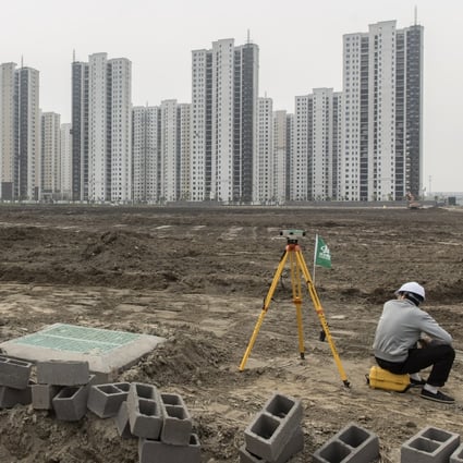 A surveyor sits on a construction site in Ningbo, China, on April 26, 2020. Local governments have long offered firms connected to China’s political elite land sale discounts. Photo: Bloomberg