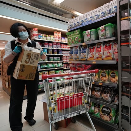 Staff and a customer at a Wellcome supermarket at Metro City in Tseung Kwan O earlier this week. Photo: Felix Wong