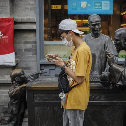 Beijing is allowing people to go mask-free outdoors unless they are with someone other than a companion. Photo: EPA-EFE