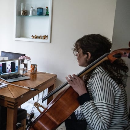 A cello student in Istanbul, Turkey, receives a remote lesson from her teacher. Photo: Getty Images