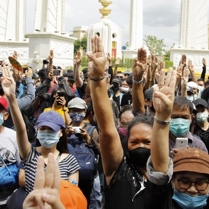 Thai protesters flash the three-finger salute during an anti-government protest at the Democracy Monument in Bangkok. Photo: EPA