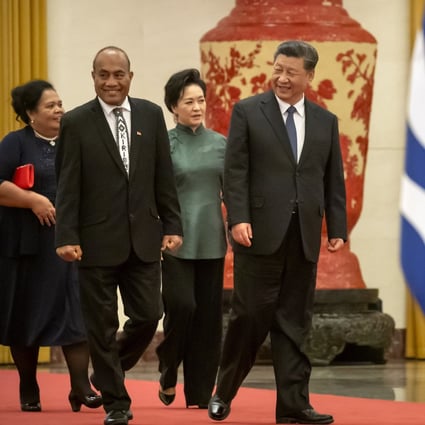 Kiribati's President Taneti Maamau, left, and Chinese President Xi Jinping walk together during a welcome ceremony at Beijing’s Great Hall of the People in January. Photo: AP