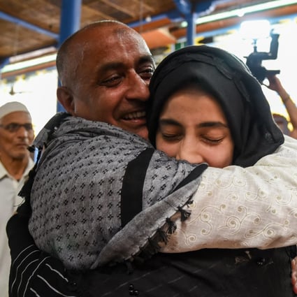 Mohammed Ali Bhat hugs a relative after his release from prison in 2019. Photo: Getty Images