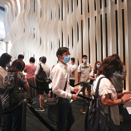 Buyers lining up at the Tsim Sha Tsui sales office of the Seacoast Royale project in Tuen Mun on 22 August 2020. As many as 11,000 people submitted bids for 168 units, or about 66 buyers for every available flat. Photo: Xiaomei Chen