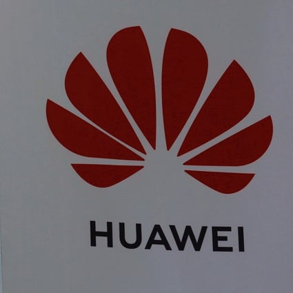 FILE PHOTO: A Huawei sign is seen outside its store at a shopping complex in Beijing, China July 14, 2020. REUTERS/Tingshu Wang/File Photo