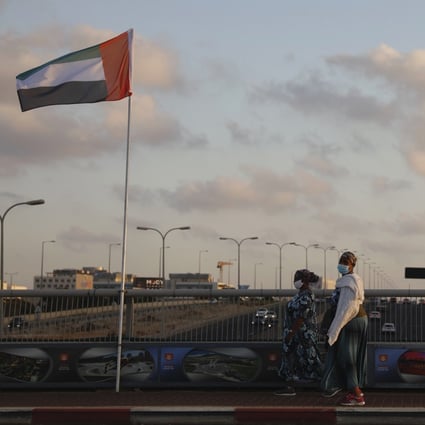 The flags of the United Arab Emirates and Israel fly at the Peace Bridge in Netanya, Israel, after the two countries agreed to diplomatic recognition. Photo: AP