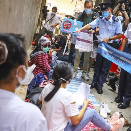 Hong Kong police conduct inspections in Tsuen Wan, asking foreign domestic workers to comply with ongoing Covid-19 social distancing measures. Photo: Dickson Lee