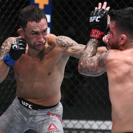 Frankie Edgar punches Pedro Munhoz in their bantamweight fight during the UFC Fight Night event at UFC Apex on August 22, 2020 in Las Vegas, Nevada. Photos: Chris Unger/Zuffa LLC