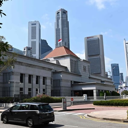 The national flag of Singapore flies on the roof of Parliament House in this file photo. Photo: AFP