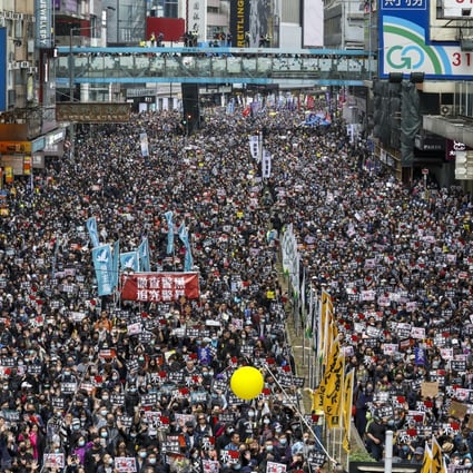 Anti-government protesters participate in a New Year's Day march organised by the Civil Human Rights Front on Hennessy Road in Causeway Bay earlier this year. Photo: Nora Tam