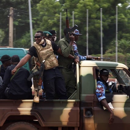 Malian soldiers drive through the streets of Bamako on Wednesday, a day after rebel military leaders forced President Ibrahim Boubacar Keita from office. Photo: AFP