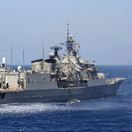 A Greek frigate and military helicopter take part in a military exercise with EU allies in the eastern Mediterranean Sea on August 25, amid escalating tensions between Athens and Ankara. Photo: AFP