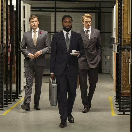 John David Washington (centre) and Robert Pattinson (right) in a still from Tenet, which wrapped shooting last year before the coronavirus outbreak.